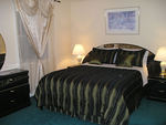 This beautiful queen size bed in the Domino Suite invites you to go to sleep whenever you feel like
