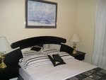 Very comfy and good looking queen size bed in the No Name Suite with TV and dresser with the usual special mirror